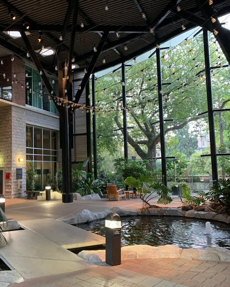 Your desk, with a hotel atrium